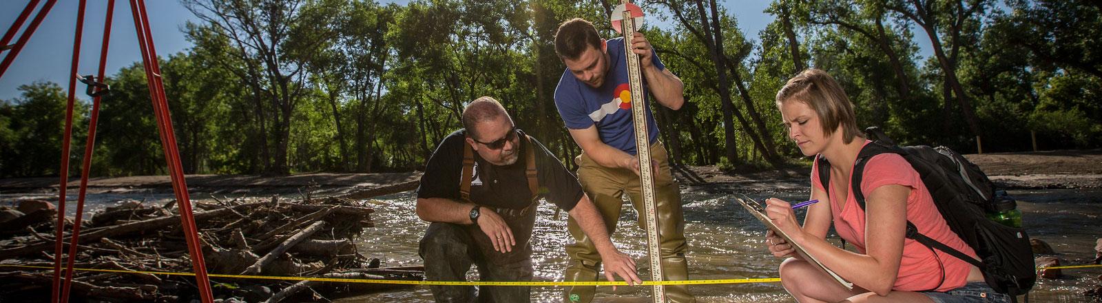 Scientists out in the field completing river research in Colorado